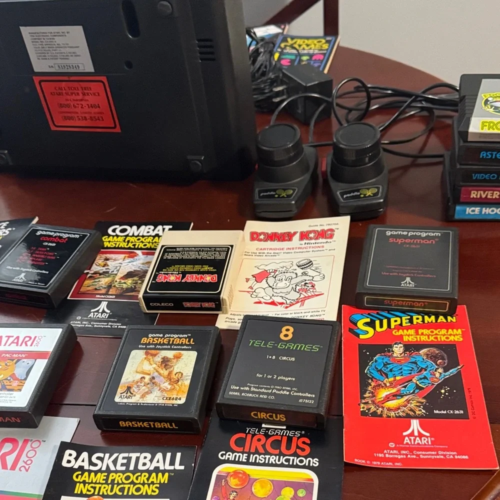 Vintage Authentic Atari 2600 with controllers, games and instruction booklets.